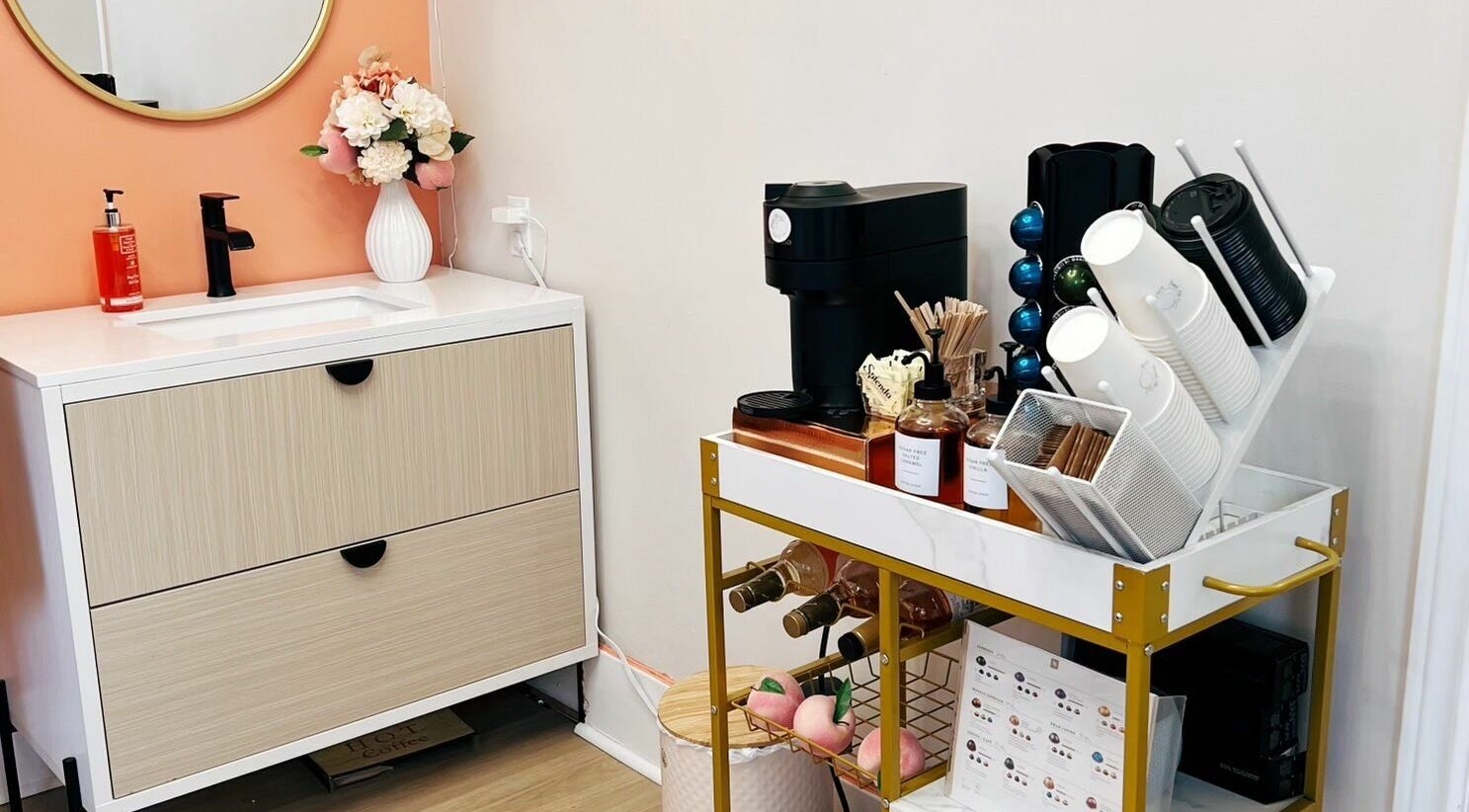 Chic vanity and coffee area at Peach Pit Beauty Hub in Waterloo, Ontario, CA.