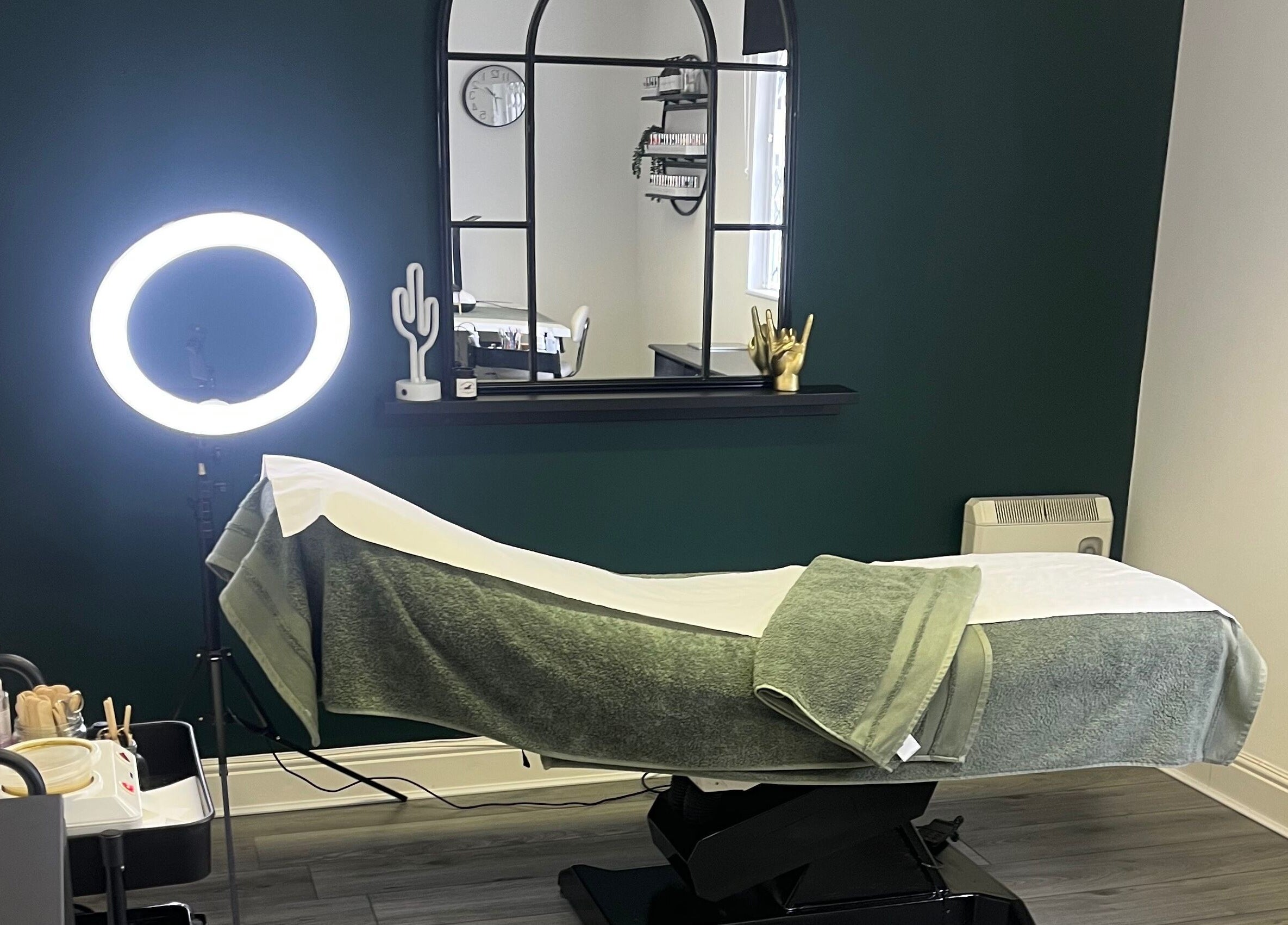 Relaxing treatment room at Everlong Nails and Beauty, Little Horwood, GB with ambient lighting and comfortable bed.