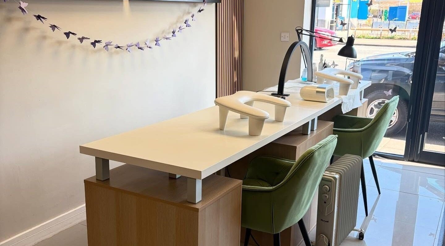 Elegant manicure station at Project Beauty in Stockport, England, GB with stylish decor and seating.