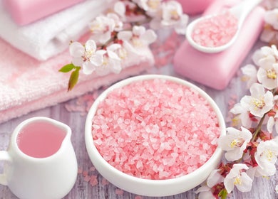 Pink bath salts with blossoms at Pure Miracle Clyde North Massage, Melbourne, Victoria, AU.