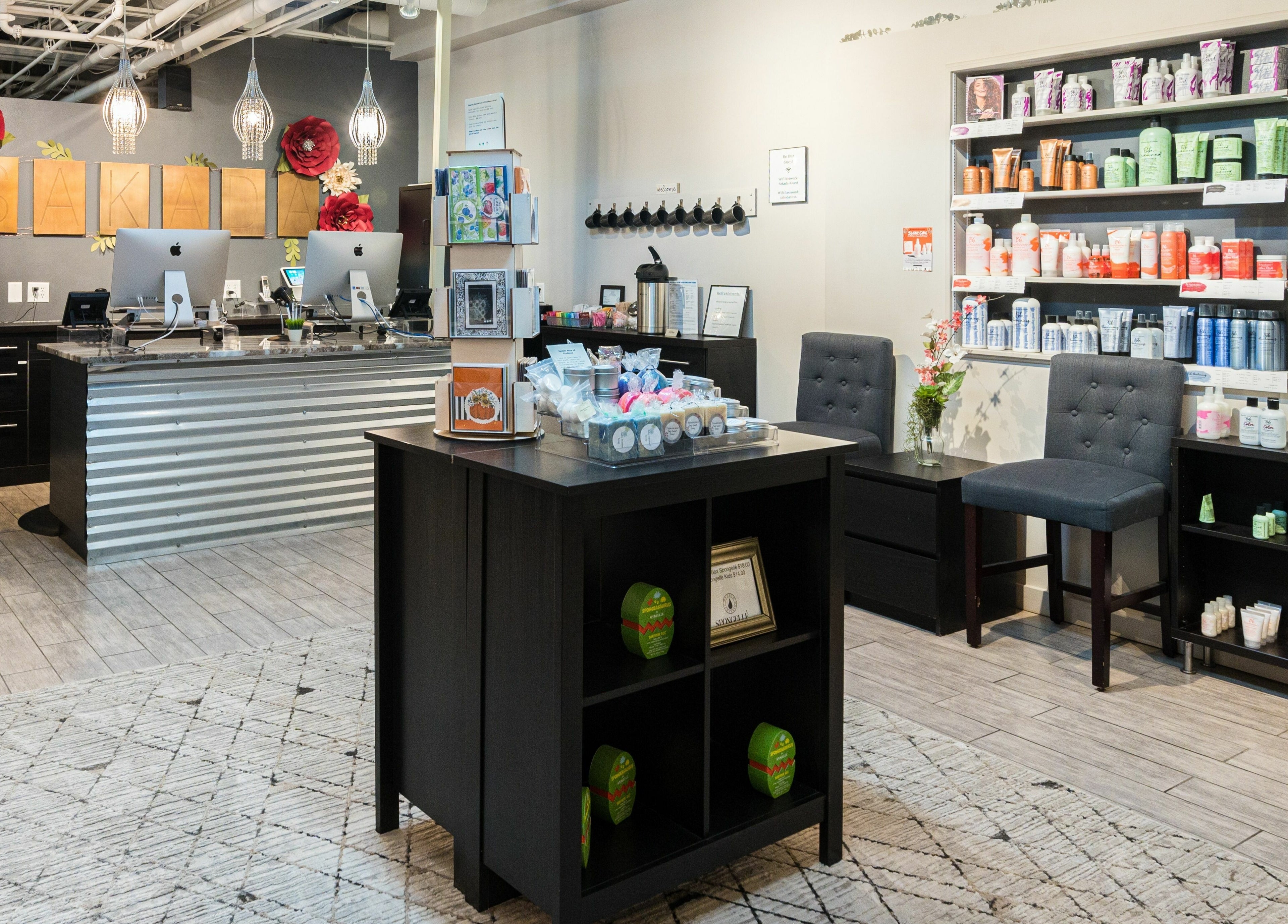 Chic reception area at Sakada, Minnetonka, Minnesota, US with elegant decor and beauty products display.