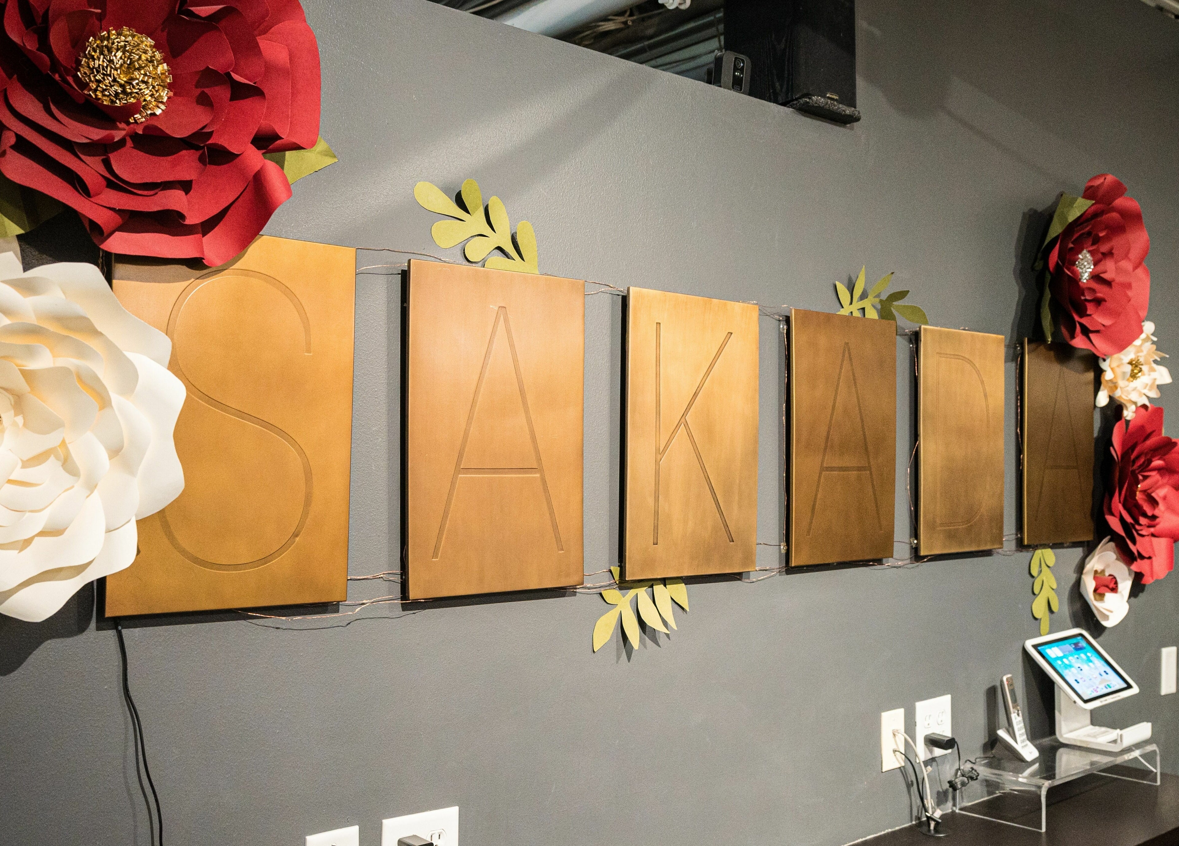 Elegant Sakada sign with large floral decor in Minnetonka, Minnesota, US.