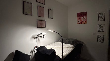 Relaxing treatment room at Lash & Co., Hawkinge, England, GB with soothing decor and soft lighting.