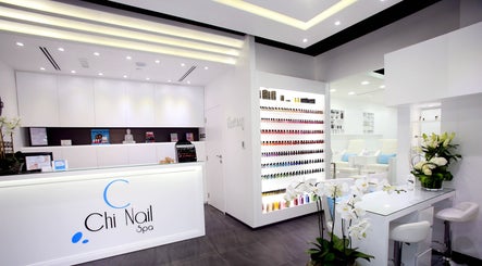Elegant interior of Chi Nail Spa - JVT in Dubai, AE, showcasing modern decor and nail polish display.