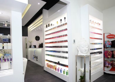 Interior of Chi Nail Spa - JVT with vibrant nail polish display in Dubai, Dubai, AE.
