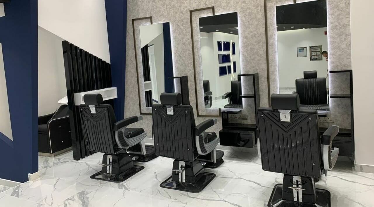 Modern barber chairs at The Cool Crop Gents Salon, Dubai, Dubai, AE, showcasing sleek design and comfort.