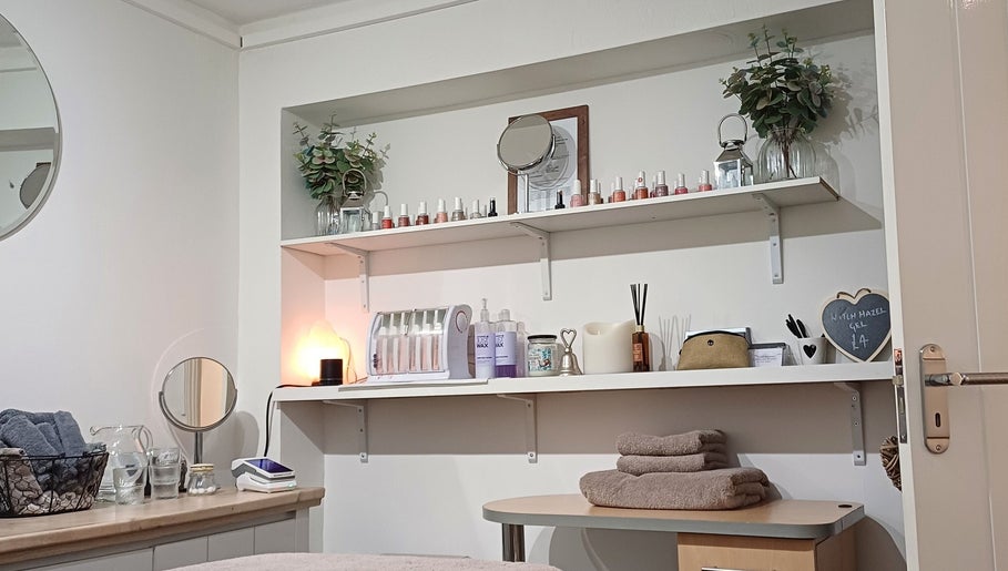 Cozy treatment room at Advanced Beauty by Lauren Williams, Sudbury, England, GB, featuring elegant shelves.