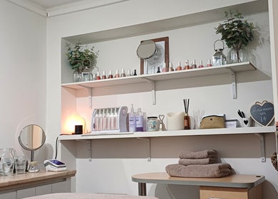Cozy treatment room at Advanced Beauty by Lauren Williams, Sudbury, England, GB, featuring elegant shelves.