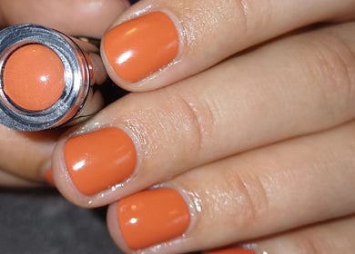 Stylish orange manicure at Advanced Beauty by Lauren Williams, Sudbury, England, GB, showcasing vibrant nail art.