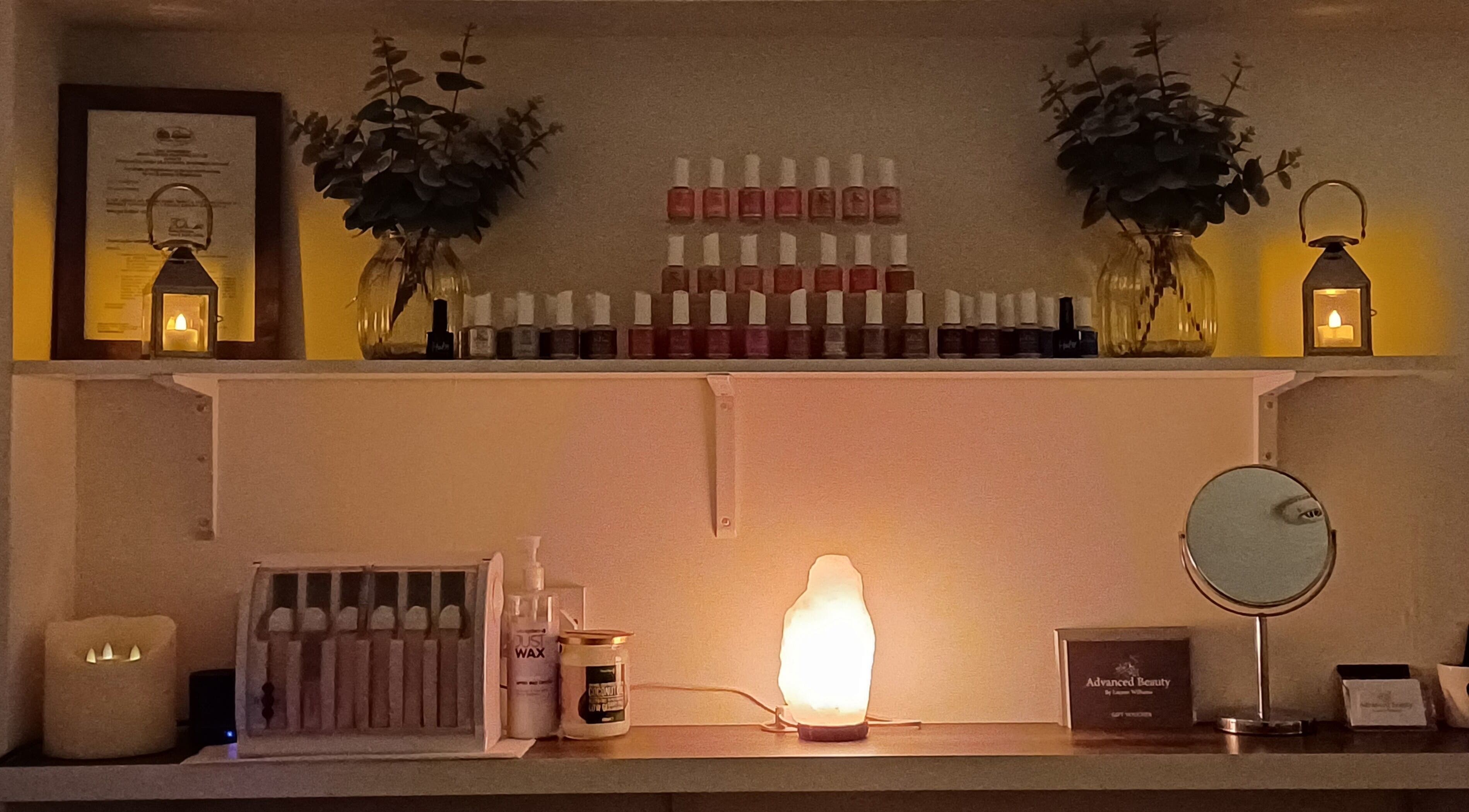 Warmly lit shelf with beauty products at Advanced Beauty by Lauren Williams, Sudbury, England, GB.