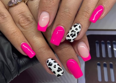 Chic pink and cow-print nail art at Beauty Dolls, Basingstoke, England, GB.