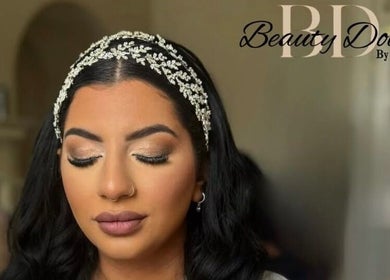 Woman with elegant makeup and jeweled headband at Beauty Dolls, Basingstoke, England, GB.