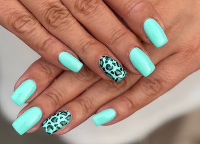 Stylish aqua nails with leopard print at Beauty Dolls, Basingstoke, England, GB.