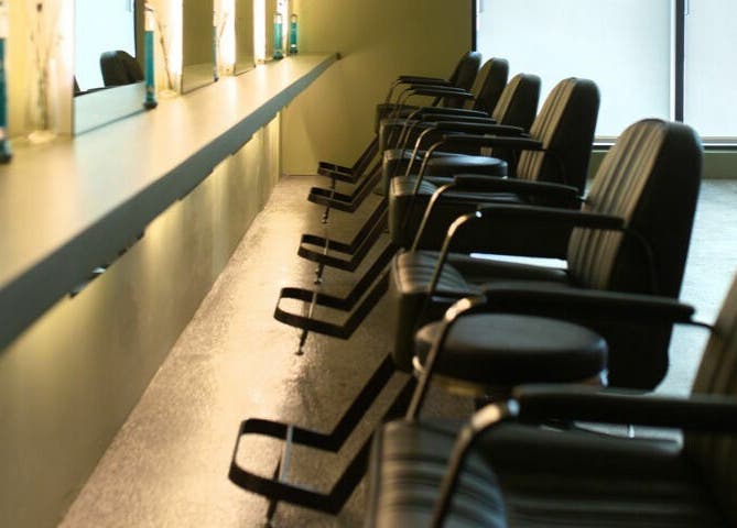 Stylish seating at Initial Salon in Richmond, British Columbia, CA. Modern and inviting ambiance.