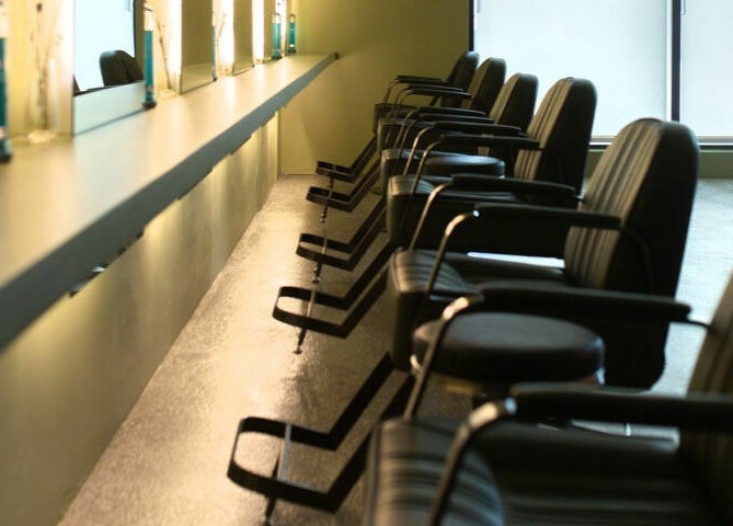 Stylish seating at Initial Salon in Richmond, British Columbia, CA. Modern and inviting ambiance.