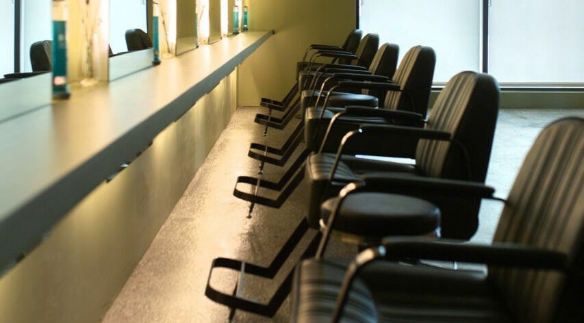 Stylish seating at Initial Salon in Richmond, British Columbia, CA. Modern and inviting ambiance.