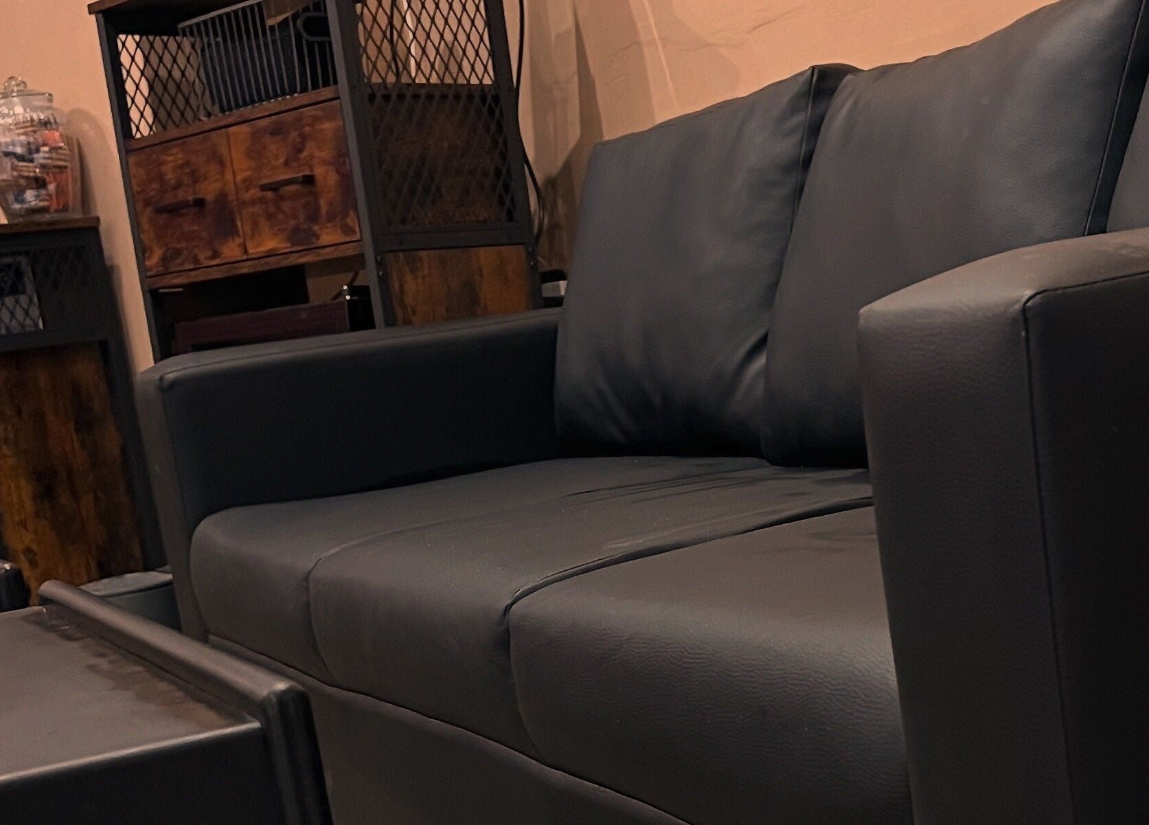 Elegant black sofa at Haar, Kidderminster, England, GB beauty and wellness venue.