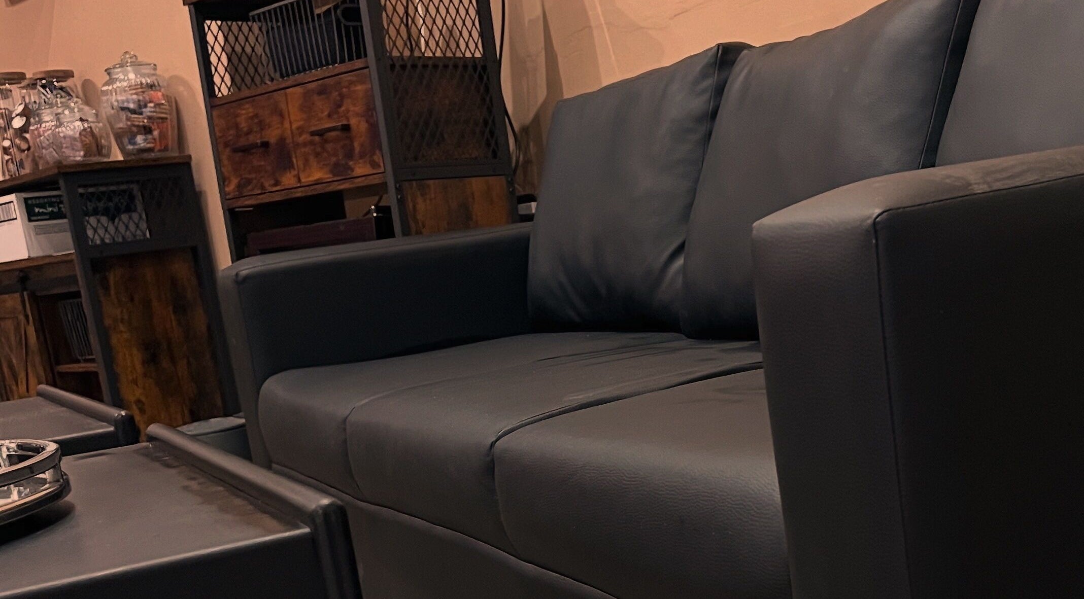 Elegant black sofa at Haar, Kidderminster, England, GB beauty and wellness venue.