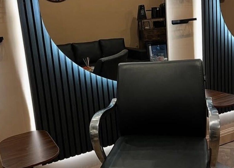 Modern salon chair and elegant mirror at Haar in Kidderminster, England, GB.