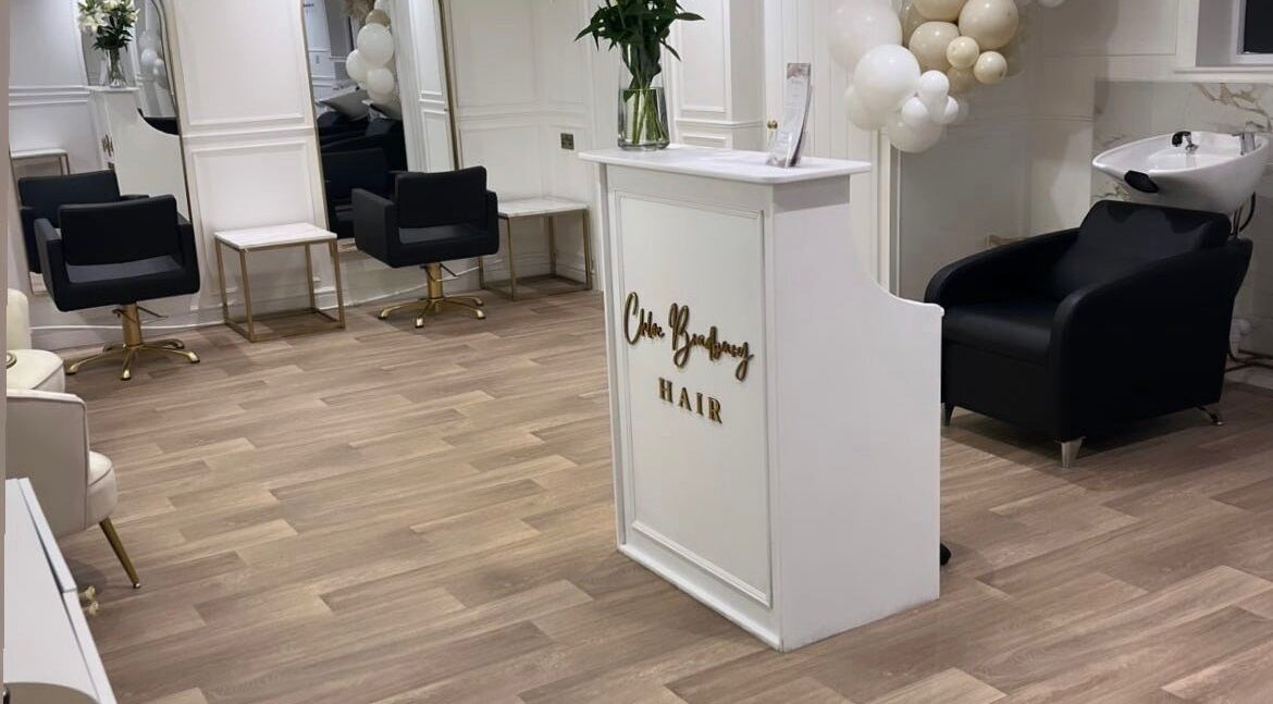 Modern salon interior at Hair by Holliex in Shrewsbury, England, GB featuring stylish chairs and decor.