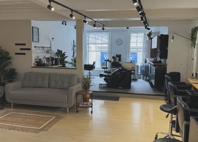 Niki Bartos Hairstylist salon in Norwich, England, GB, featuring modern styling chairs and elegant decor.