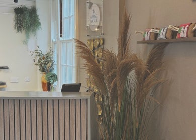 Reception at Niki Bartos Hairstylist, Norwich, England, GB featuring elegant decor and styling products.