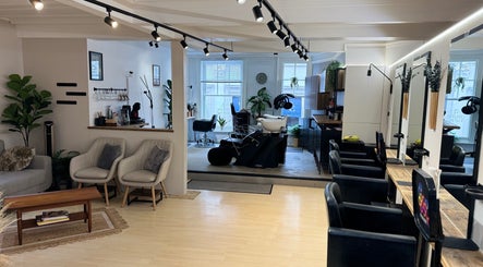 Modern interior of Niki Bartos Hairstylist @ The Styling Lounge in Norwich, England, GB with comfortable seating.