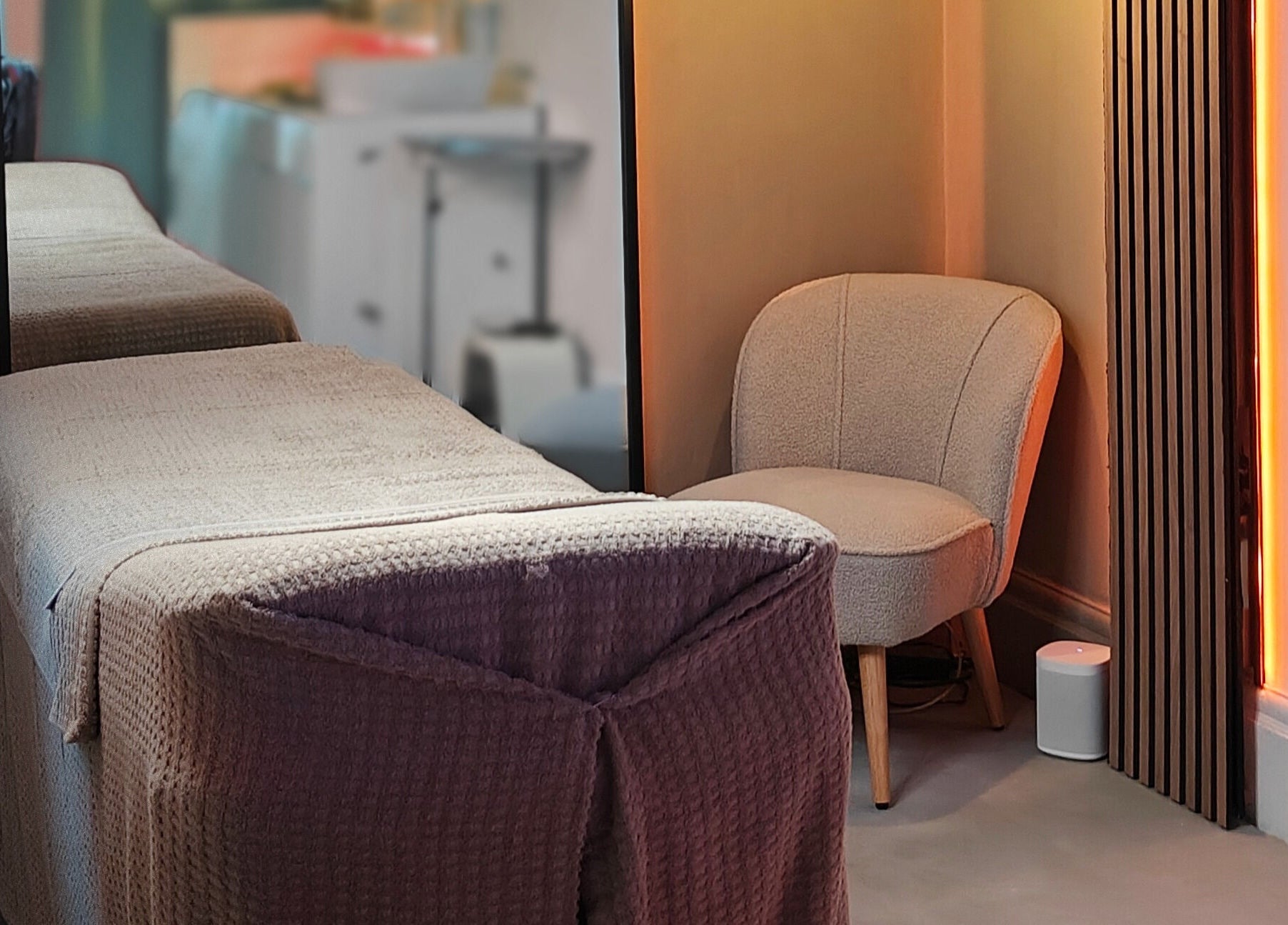Cozy treatment room with chair and bed at The Gorgeous Clinic, Blackpool, England, GB.