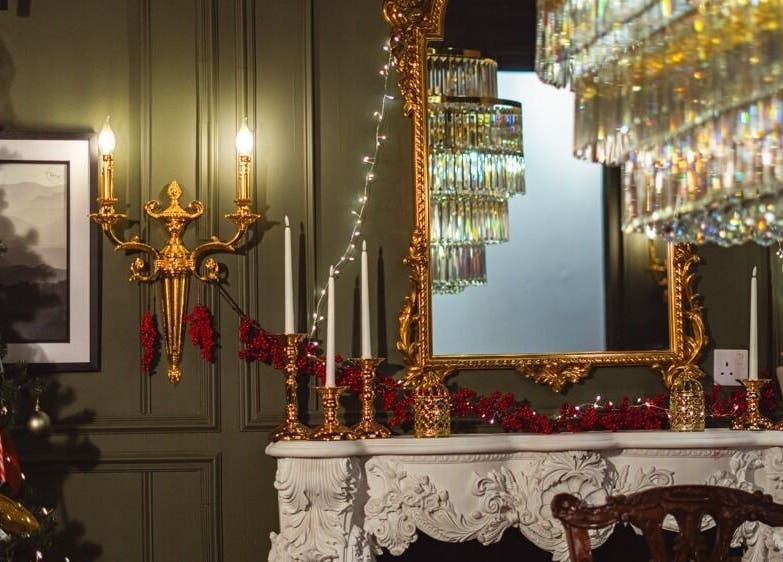 Gorgeous Clinic Blackpool, England; lavish interior with ornate mirror and chandelier.