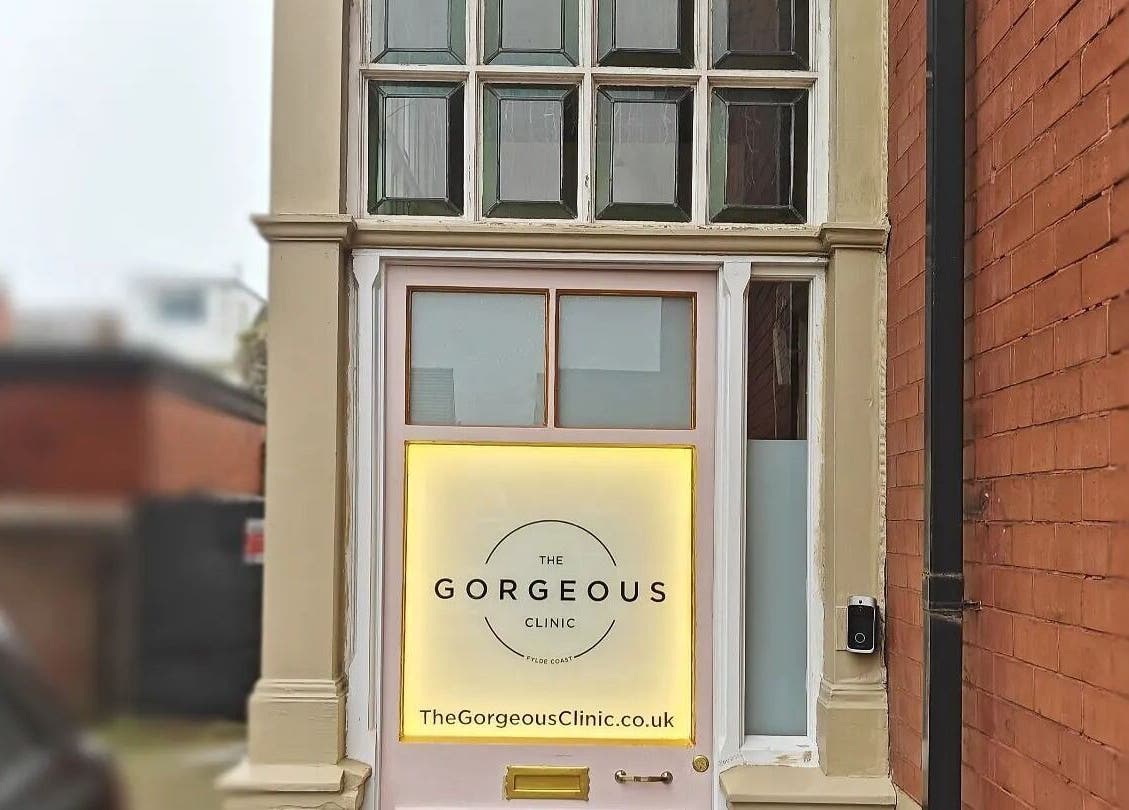 Elegant entrance of The Gorgeous Clinic in Blackpool, England featuring modern signage and classic architecture.