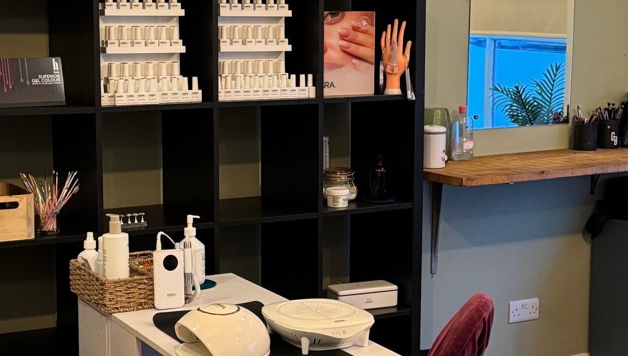 Nail care setup at Gallery of Wellbeing, Hereford, England, GB, featuring gel colors and nail tools.