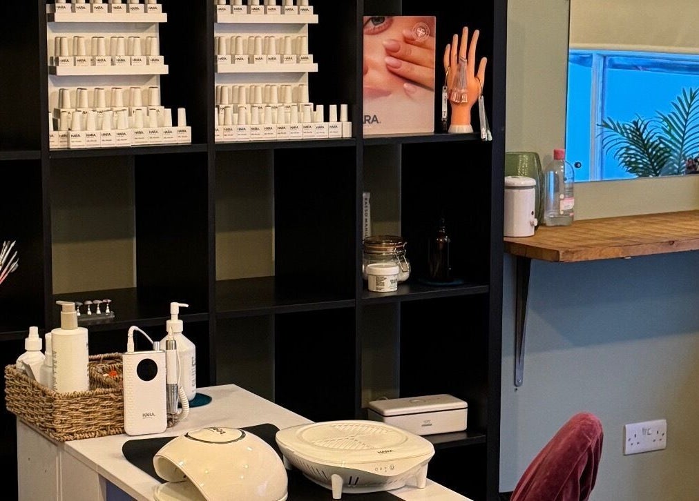 Nail care setup at Gallery of Wellbeing, Hereford, England, GB, featuring gel colors and nail tools.