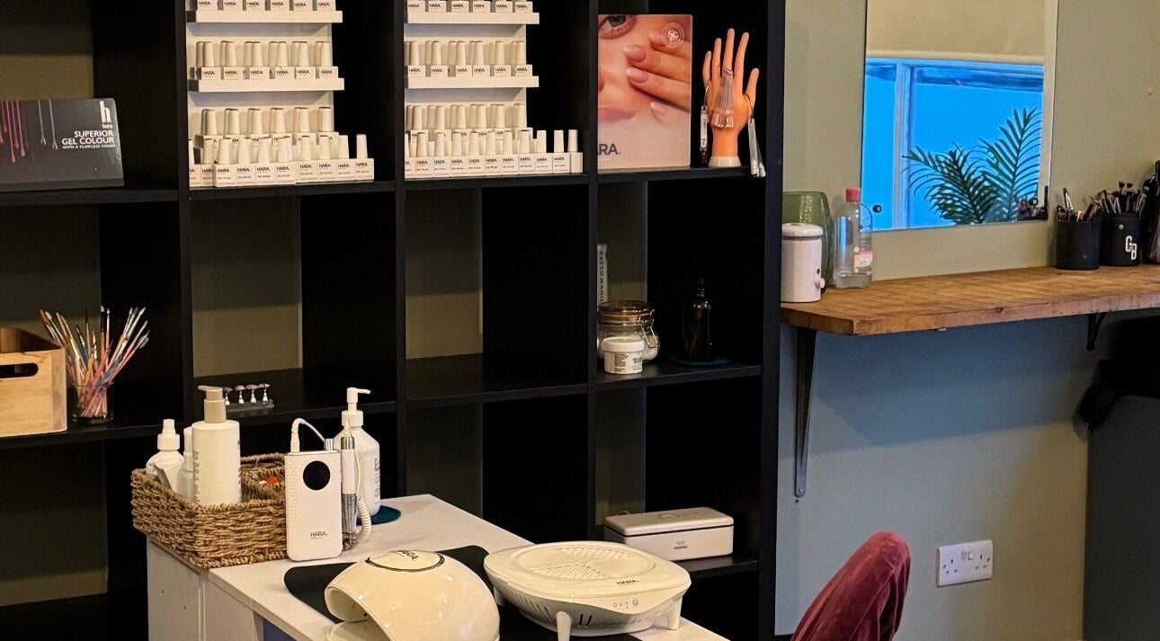 Nail care setup at Gallery of Wellbeing, Hereford, England, GB, featuring gel colors and nail tools.