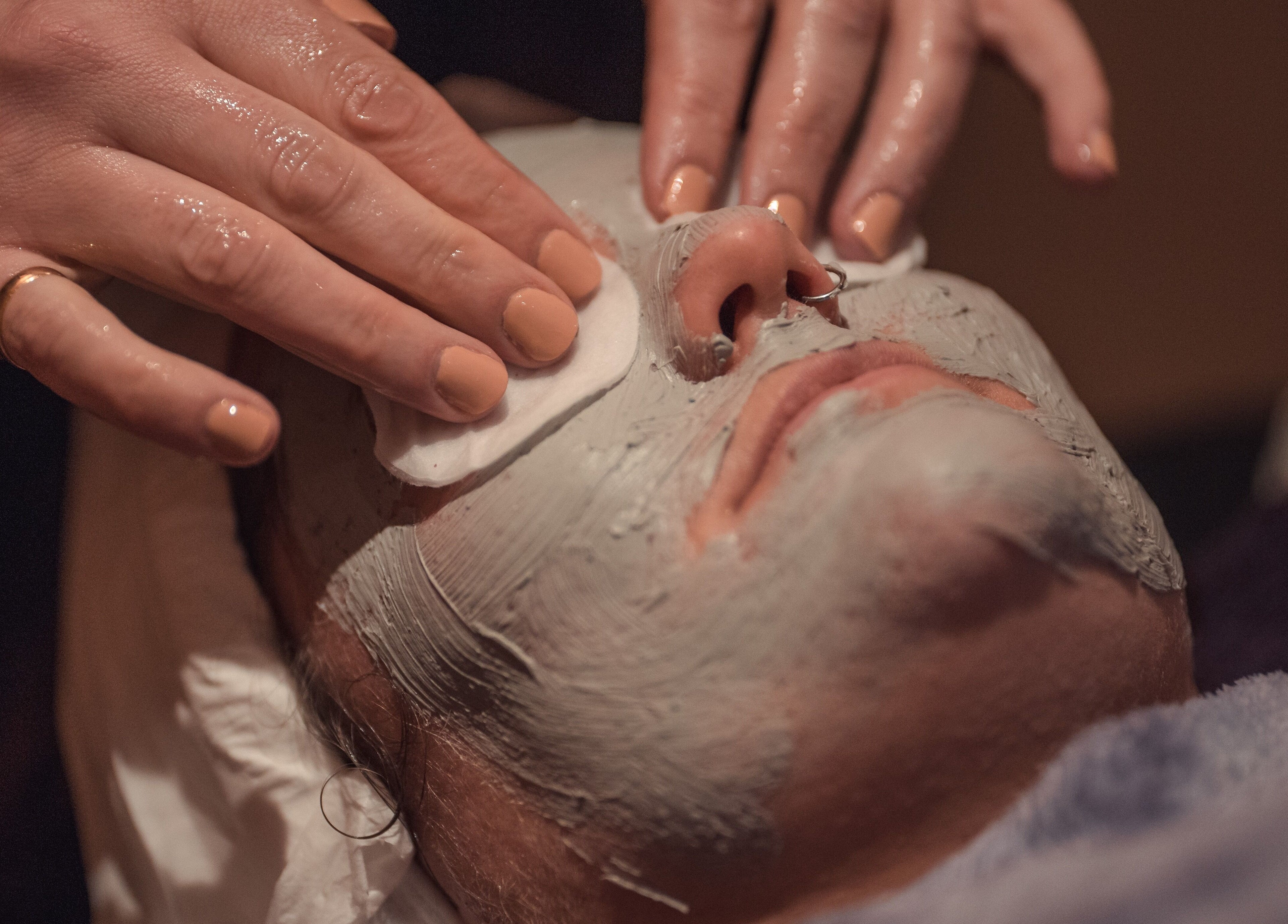 Facial treatment at Gallery of Wellbeing, Hereford, England, GB, showcasing a relaxing clay mask application.