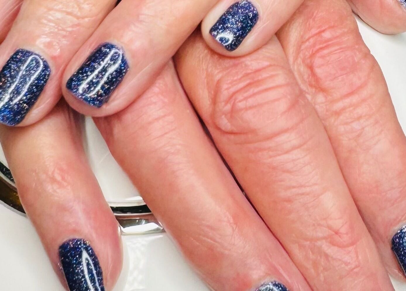 Sparkling blue nails at Gallery of Wellbeing, Hereford, England, GB.