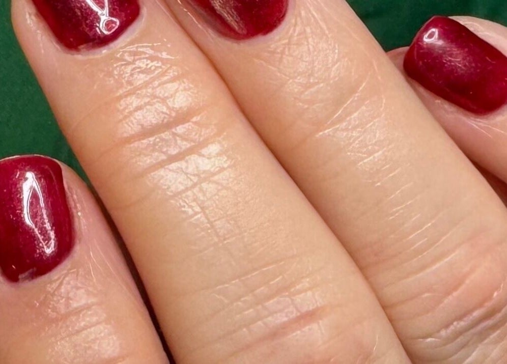 Elegant red manicure at Gallery of Wellbeing, Hereford, England, GB, highlighting exceptional nail care services.