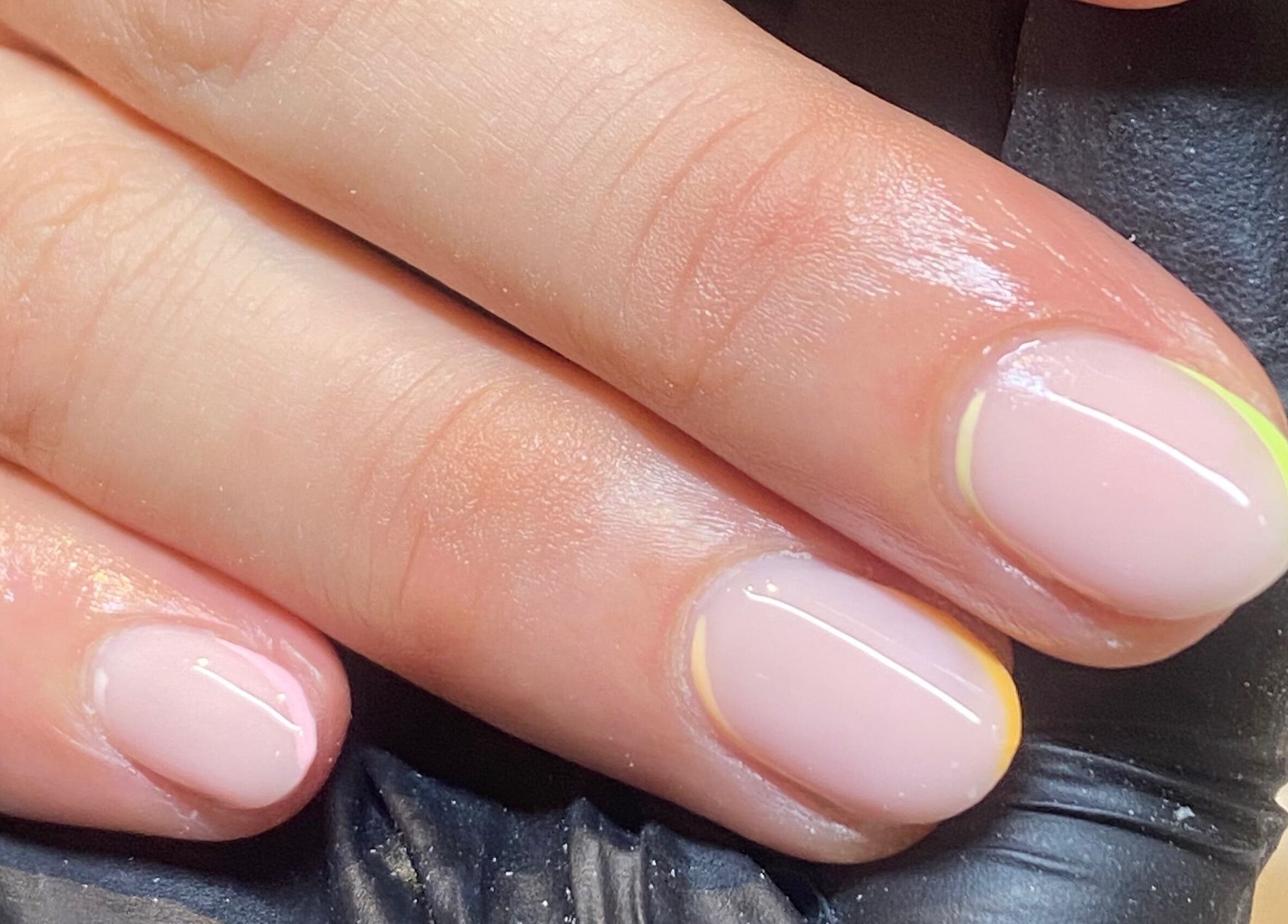 Elegant manicure at Bealer Beauty, Basingstoke, England, GB showcasing glossy pastel nails.