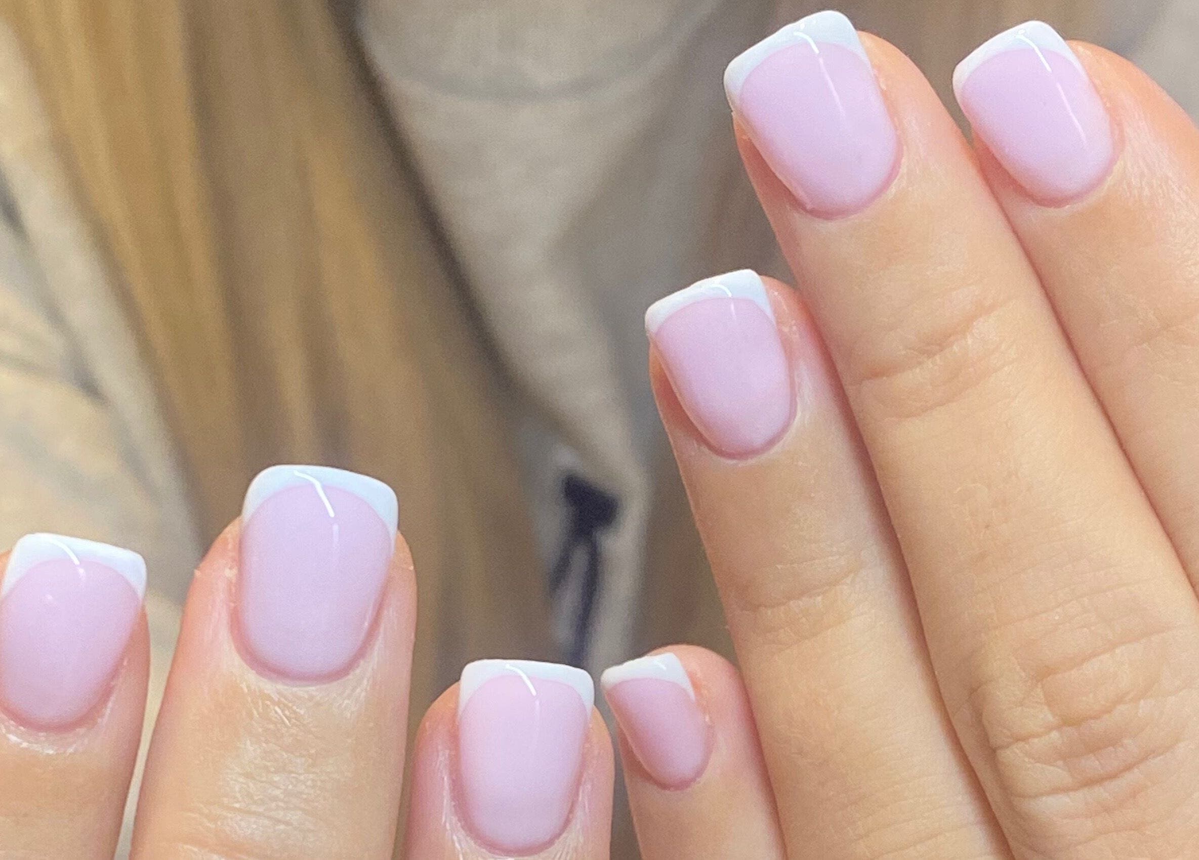 Elegant French manicure at Bealer Beauty, Basingstoke, England, GB. Perfectly styled light pink nails.