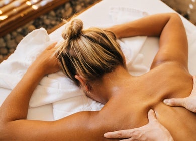 Client enjoying a relaxing back massage at Boutique Massage Studios in Meadow Springs, Western Australia, AU.