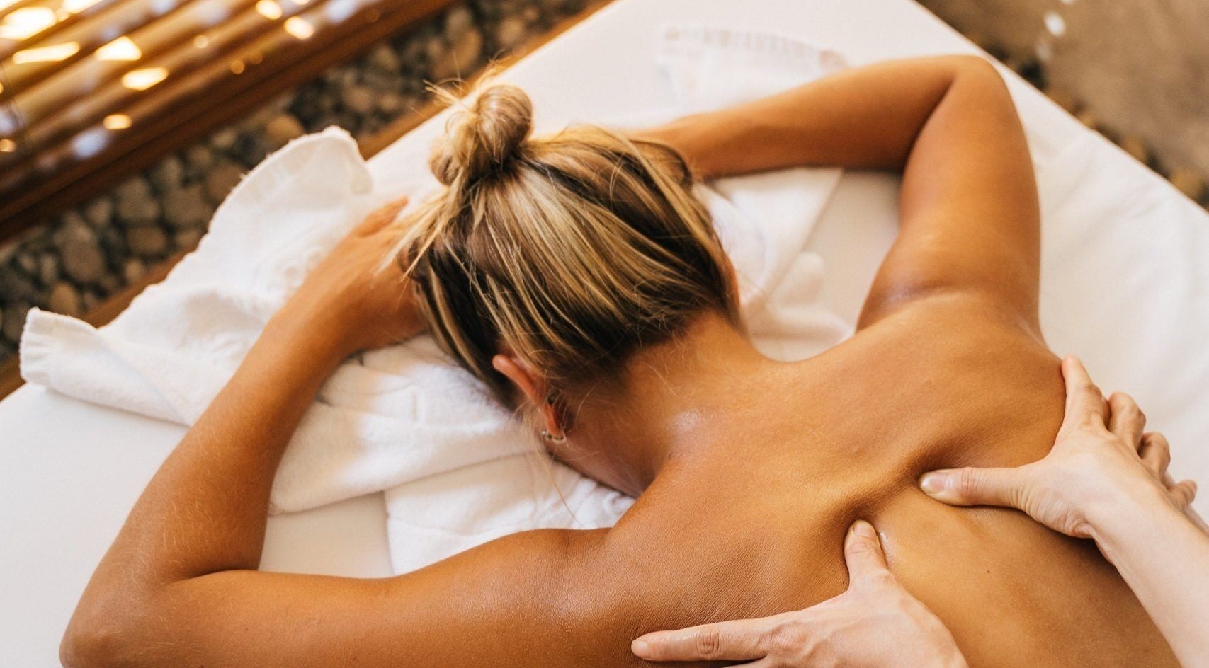 Client enjoying a relaxing back massage at Boutique Massage Studios in Meadow Springs, Western Australia, AU.