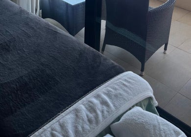 Cozy massage bed beside balcony at Mandurah Mobile Massage Therapy, Mandurah, Western Australia, AU.
