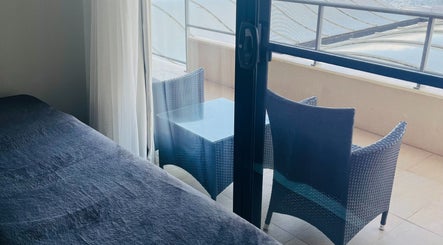 Relaxing massage bed with a balcony view at Mandurah Mobile Massage Therapy, Mandurah, Western Australia, AU.