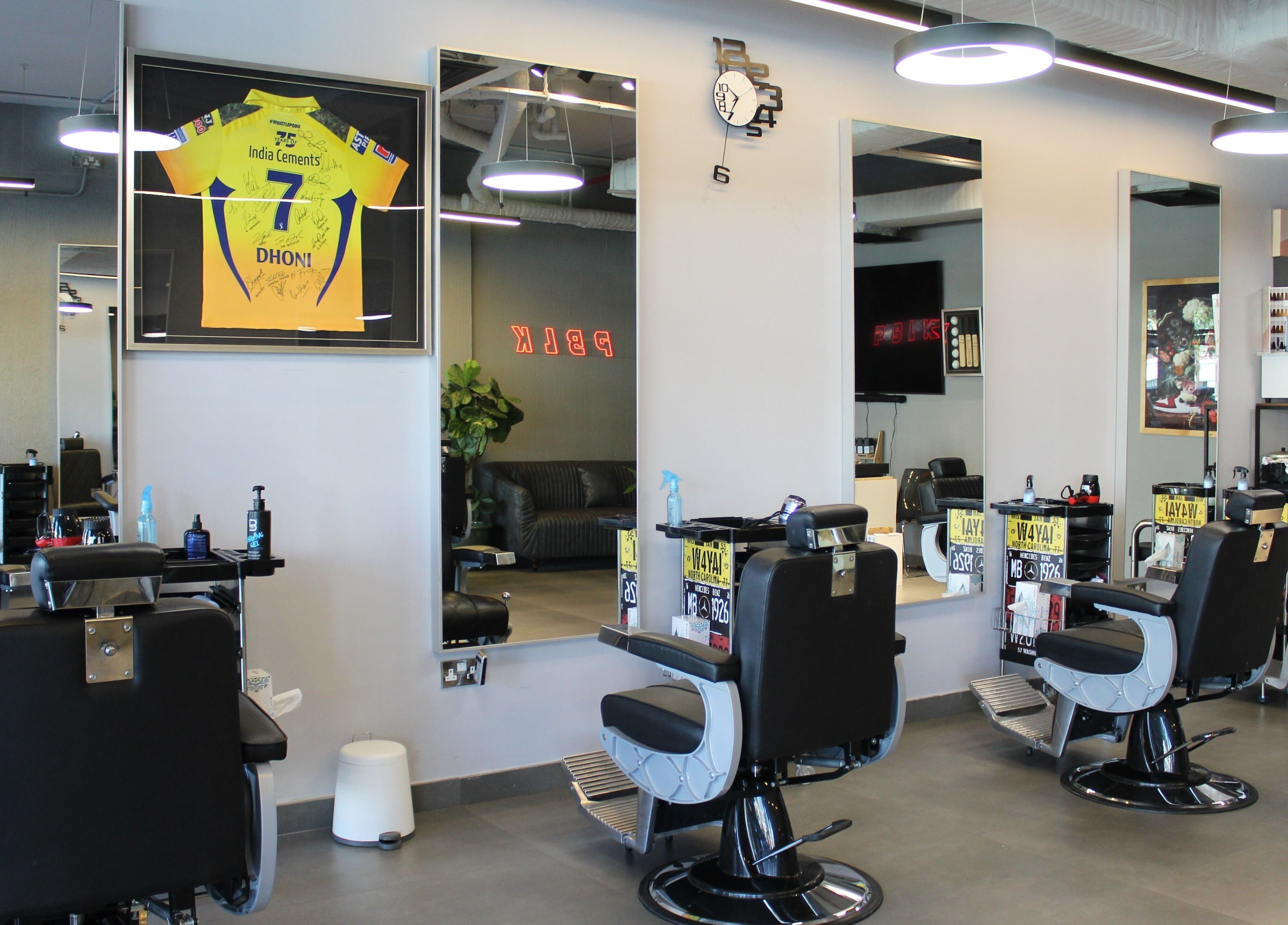 Modern interior of Evoke Gents Saloon in Dubai, AE featuring sleek barber chairs and stylish decor.