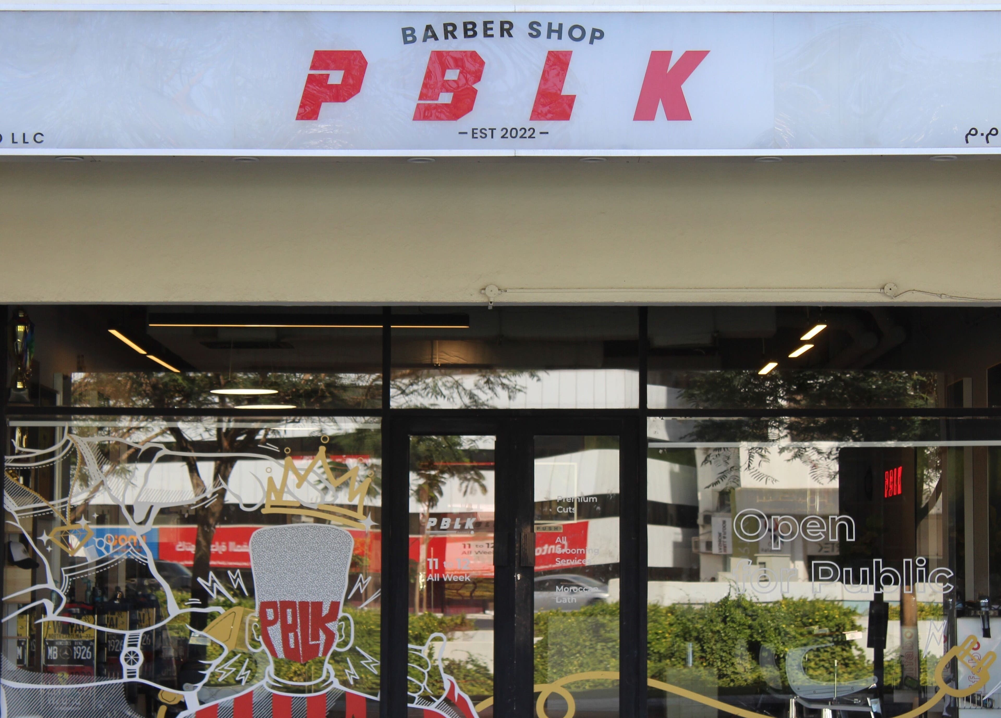 Exterior view of Evoke Gents Saloon in Dubai, AE, showcasing modern barber shop entrance design.