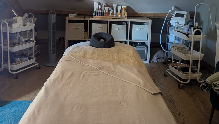 Massage room with plush table at The Beauty Barn at Pinwall, Atherstone, England, GB.