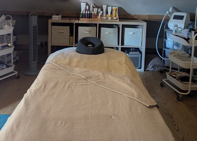 Massage room with plush table at The Beauty Barn at Pinwall, Atherstone, England, GB.