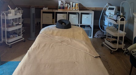 Massage room with plush table at The Beauty Barn at Pinwall, Atherstone, England, GB.