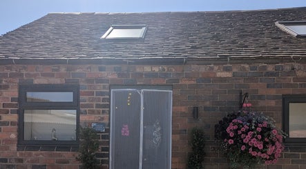 Exterior of The Beauty Barn at Pinwall, Atherstone, England, showcasing rustic charm.