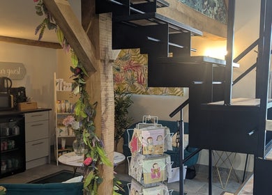 Cozy corner at The Beauty Barn at Pinwall, Atherstone, England, with a charming rustic ambiance.
