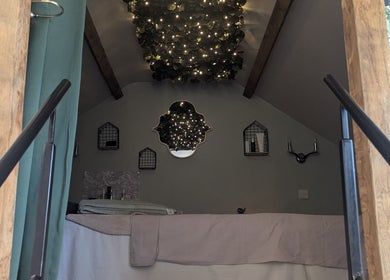 Elegant room at The Beauty Barn at Pinwall, Atherstone, England, GB featuring a luxurious bed and warm lighting.